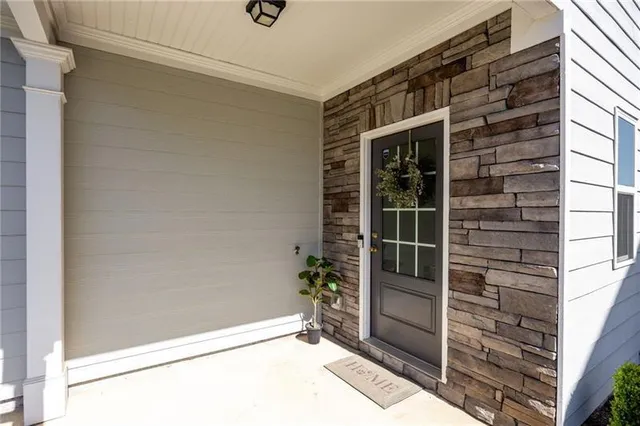a view of front door and bedroom