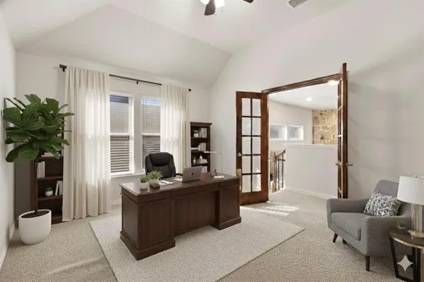 a living room with furniture and a potted plant
