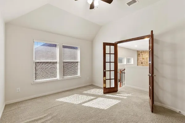 a bedroom with a bed couch and window