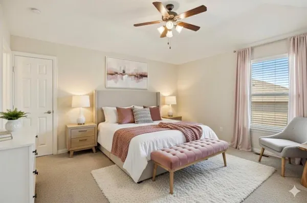 an empty room with a window and a fan