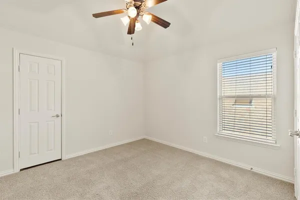 an empty room with a hallway