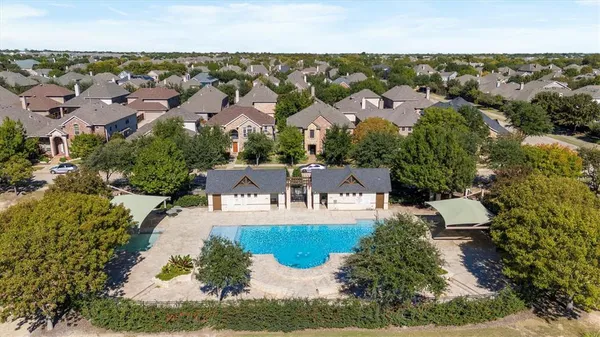 an aerial view of a house with a lake view