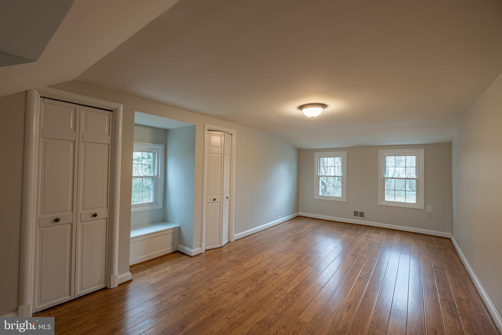 5680 Bryantown Road Bryantown, MD 20617 - Photo 22 of 33 a view of empty room with window and wooden floor