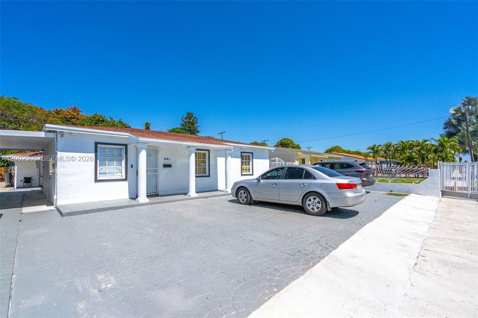 541 East 38th Street Hialeah, FL 33013 - Photo 1 of 14 a view of a car parked in front of a house