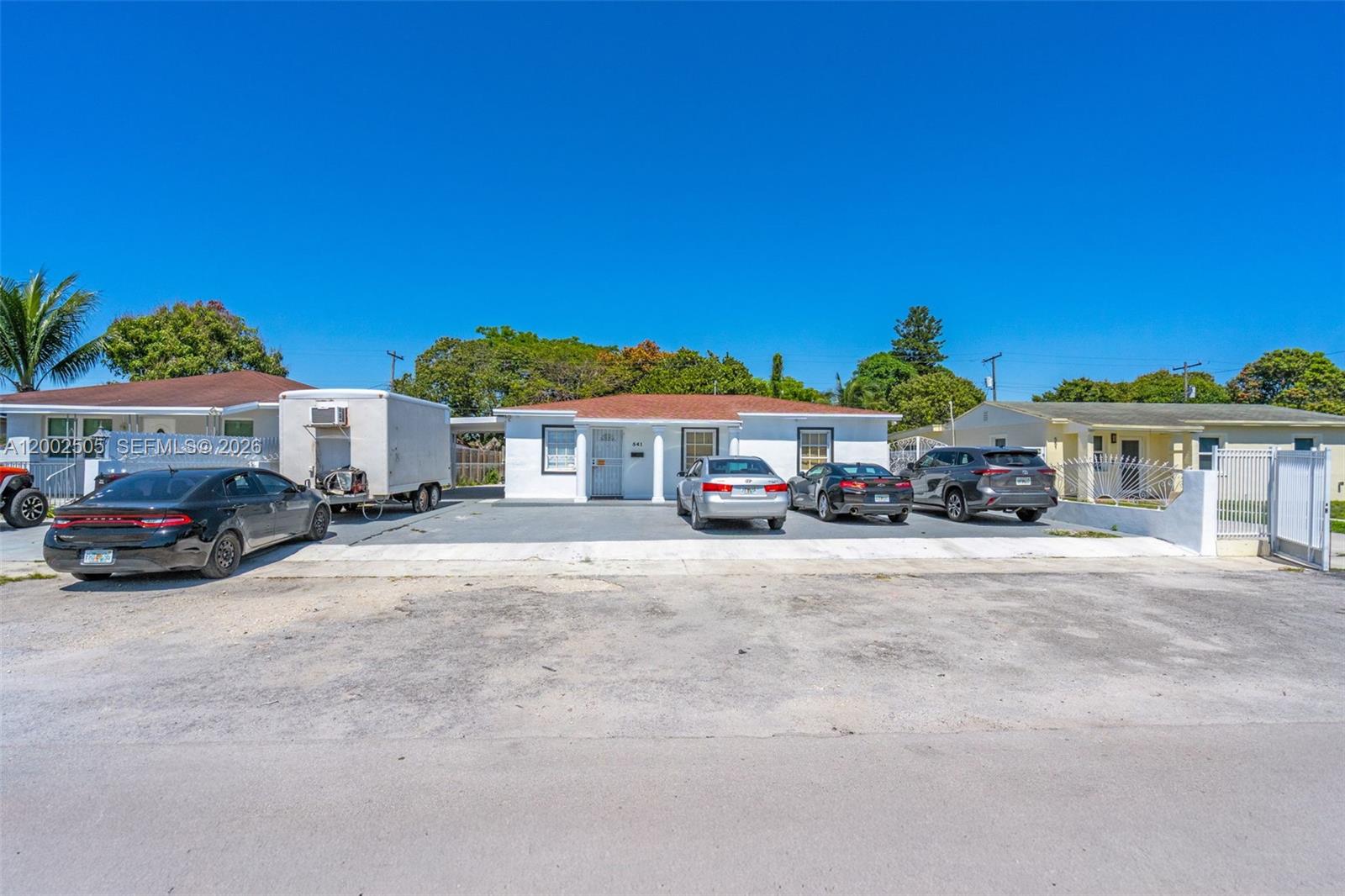 541 East 38th Street Hialeah, FL 33013 - Photo 2 of 14 a car parked in front of a house