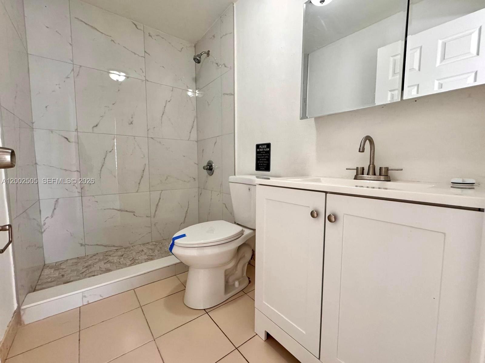 541 East 38th Street Hialeah, FL 33013 - Photo 9 of 14 a bathroom with a toilet sink and a shower