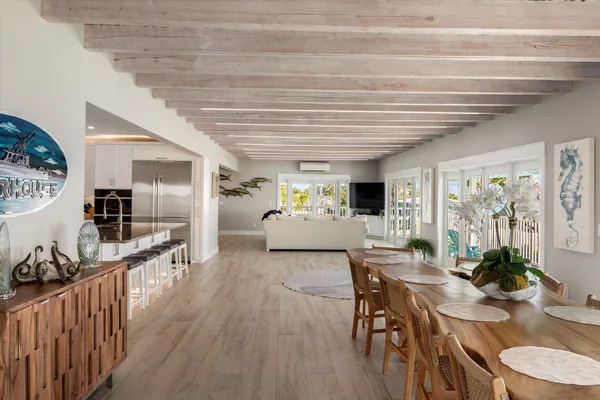 a kitchen with refrigerator and cabinets