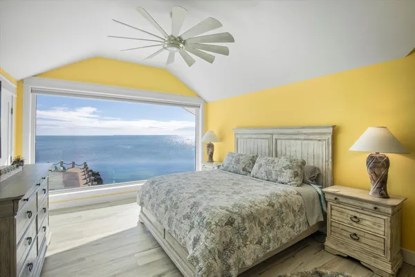 a bedroom with a bed and a cabinets