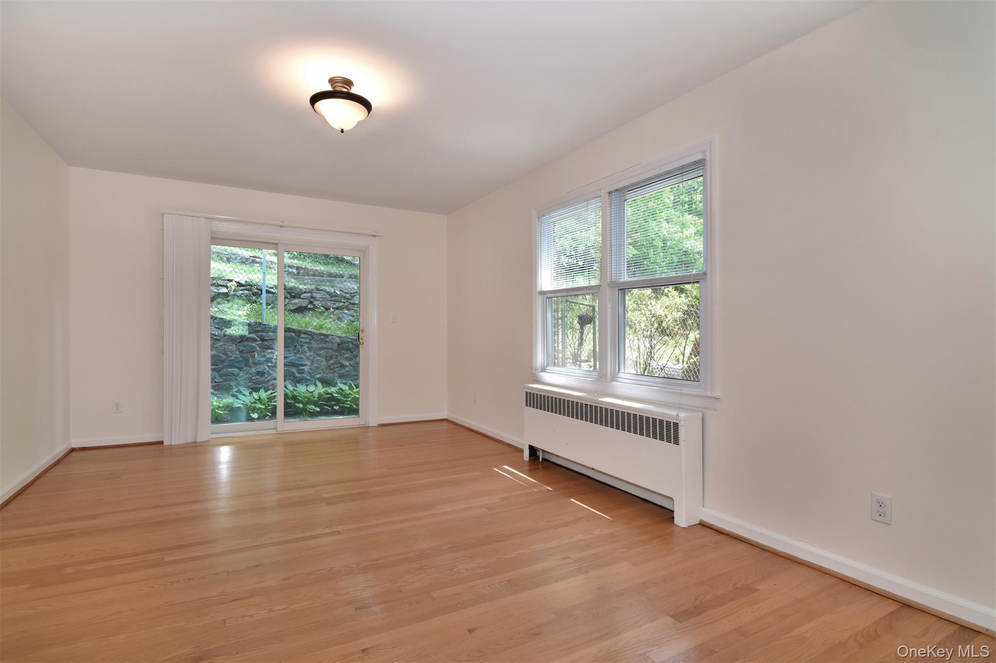 74 Briary Road Dobbs Ferry, NY 10522 - Photo 5 of 19 Full-size formal dining room with sliders out backyard.