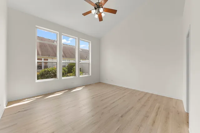 a bedroom with a large bed and a large window