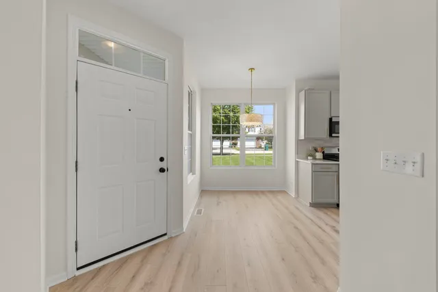 a view of a kitchen cabinets and wooden floor