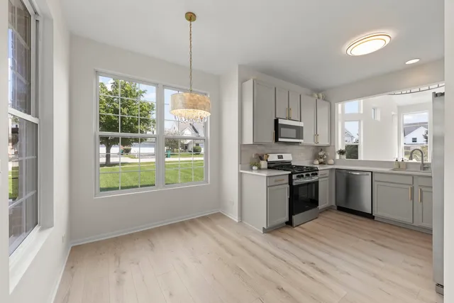 a kitchen with a window a sink and a counter top space