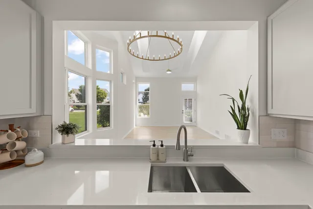 a kitchen with a sink and a window