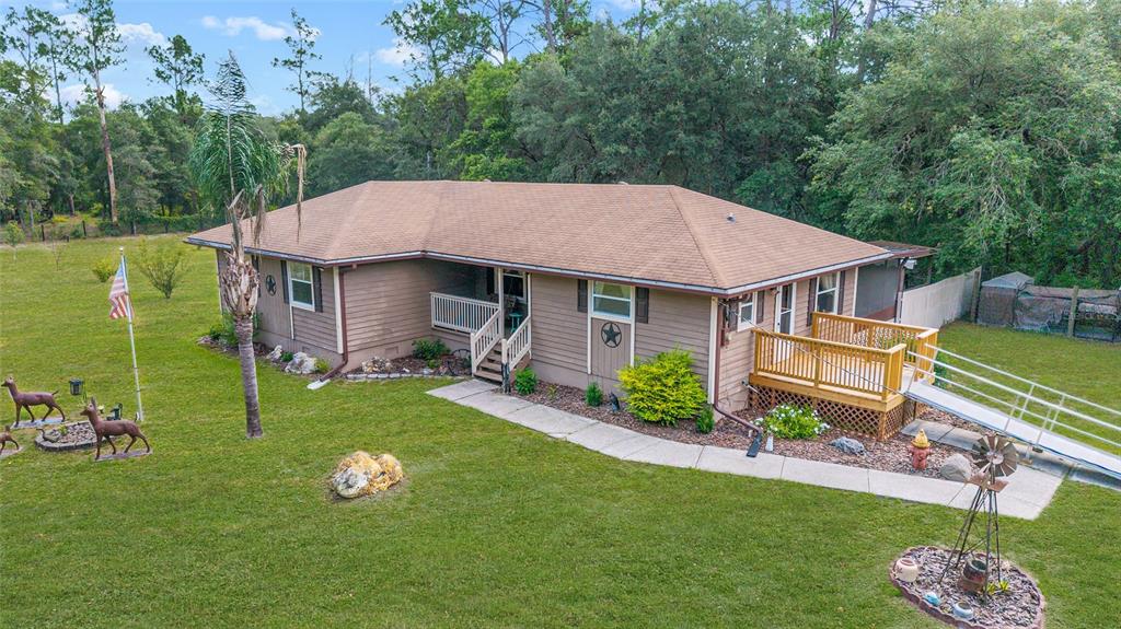 15755 Southwest 90th Avenue Dunnellon, FL 34432 - Photo 3 of 55 a aerial view of a house with garden