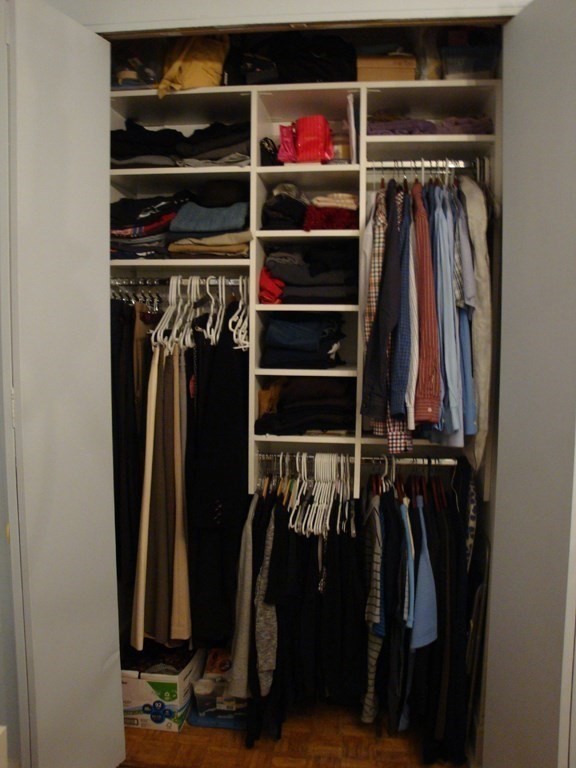 21 Beacon Street, Unit 6D Boston, MA 02108 - Photo 12 of 13 a view of walk in closet with clothes and shoes