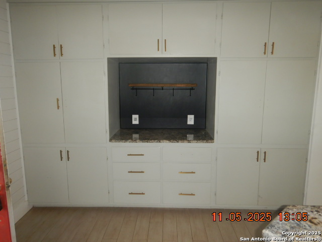 15397 Cassiano Road Elmendorf, TX 78112 - Photo 17 of 29 a bathroom with a sink and a mirror