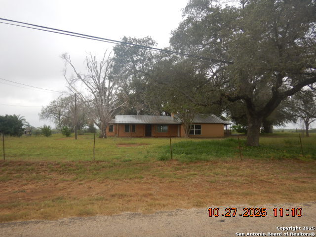 15397 Cassiano Road Elmendorf, TX 78112 - Photo 2 of 29 a view of a house with a yard