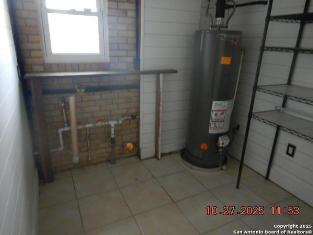 15397 Cassiano Road Elmendorf, TX 78112 - Photo 24 of 29 a view of water heater room