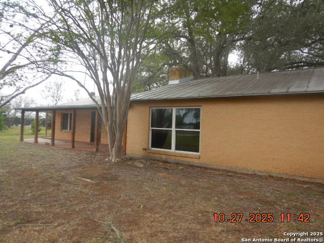 15397 Cassiano Road Elmendorf, TX 78112 - Photo 7 of 29 front view of a house with a large tree