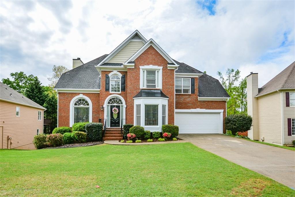 7016 Hunters Ridge Woodstock, GA 30189 - Photo 1 of 1 Amazing Traditional Home is Ready to Move In! Well-Maintained brick front and siding in sought after Deer Run West section! Enjoy all this home has to offer with 4 bedrooms and 3 full baths! Finished basement is a walkout to beautiful stoned patio! Gorgeous landscaping and fenced backyard!