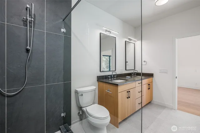 a view of a house with a yard and a forest