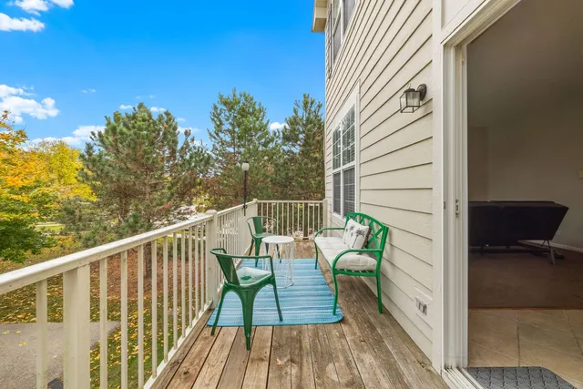 a view of balcony with furniture
