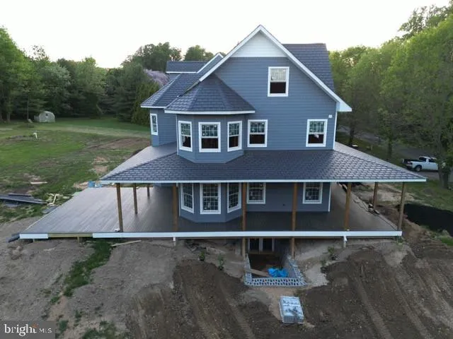 a house with trees in the background