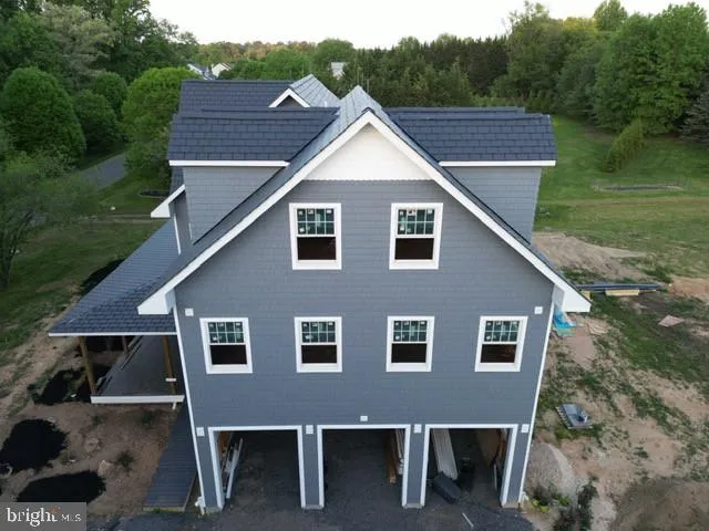 a aerial view of a house with a yard