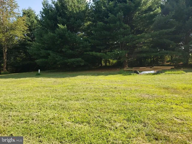 a view of a swimming pool with an outdoor space and seating area