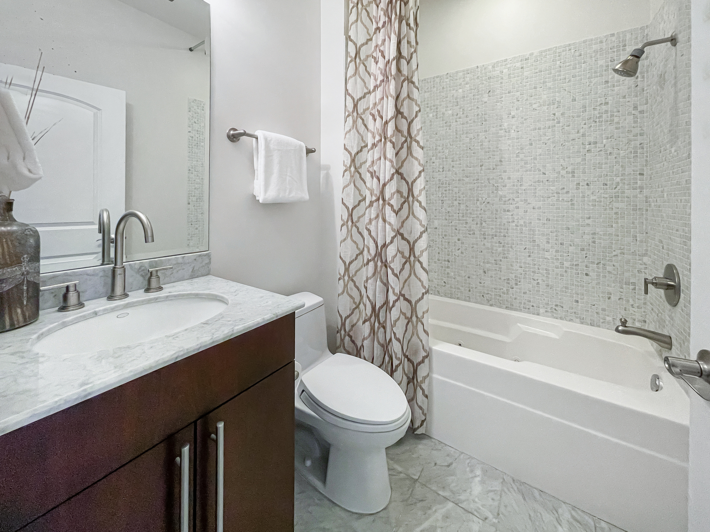 2207 West Roscoe Street, Unit 3E Chicago, IL 60618 - Photo 17 of 25 a bathroom with a sink toilet and shower