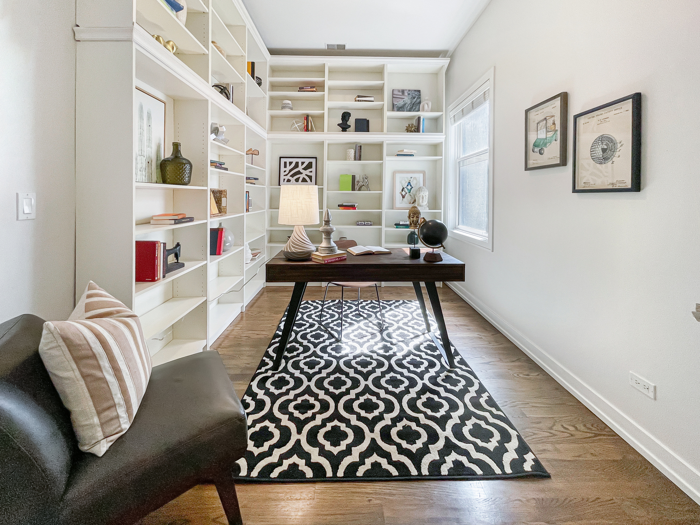 2207 West Roscoe Street, Unit 3E Chicago, IL 60618 - Photo 19 of 25 a living room with furniture and a rug