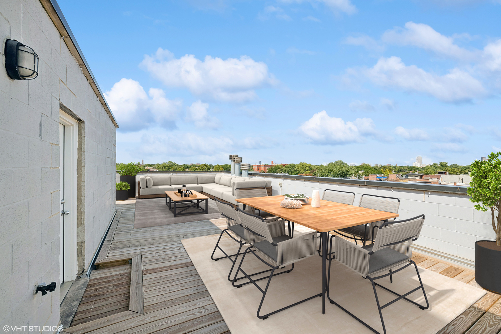 2207 West Roscoe Street, Unit 3E Chicago, IL 60618 - Photo 20 of 25 a terrace with outdoor seating and city view