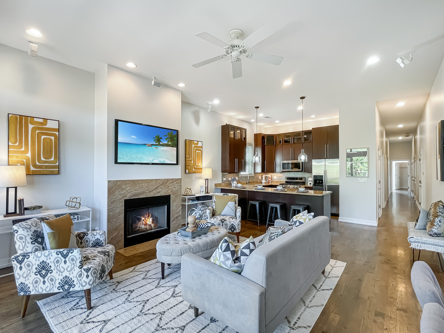 2207 West Roscoe Street, Unit 3E Chicago, IL 60618 - Photo 2 of 25 a living room with furniture and a fireplace