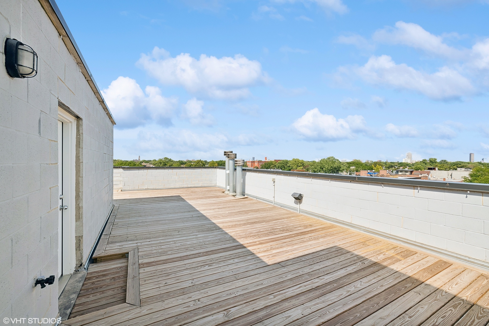 2207 West Roscoe Street, Unit 3E Chicago, IL 60618 - Photo 21 of 25 a view of terrace with seating space and hardwood floor