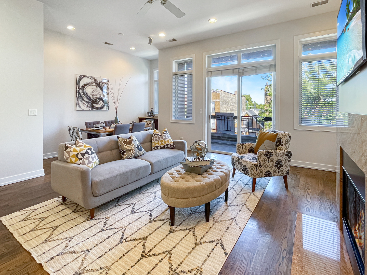 2207 West Roscoe Street, Unit 3E Chicago, IL 60618 - Photo 4 of 25 a living room with furniture and wooden floor