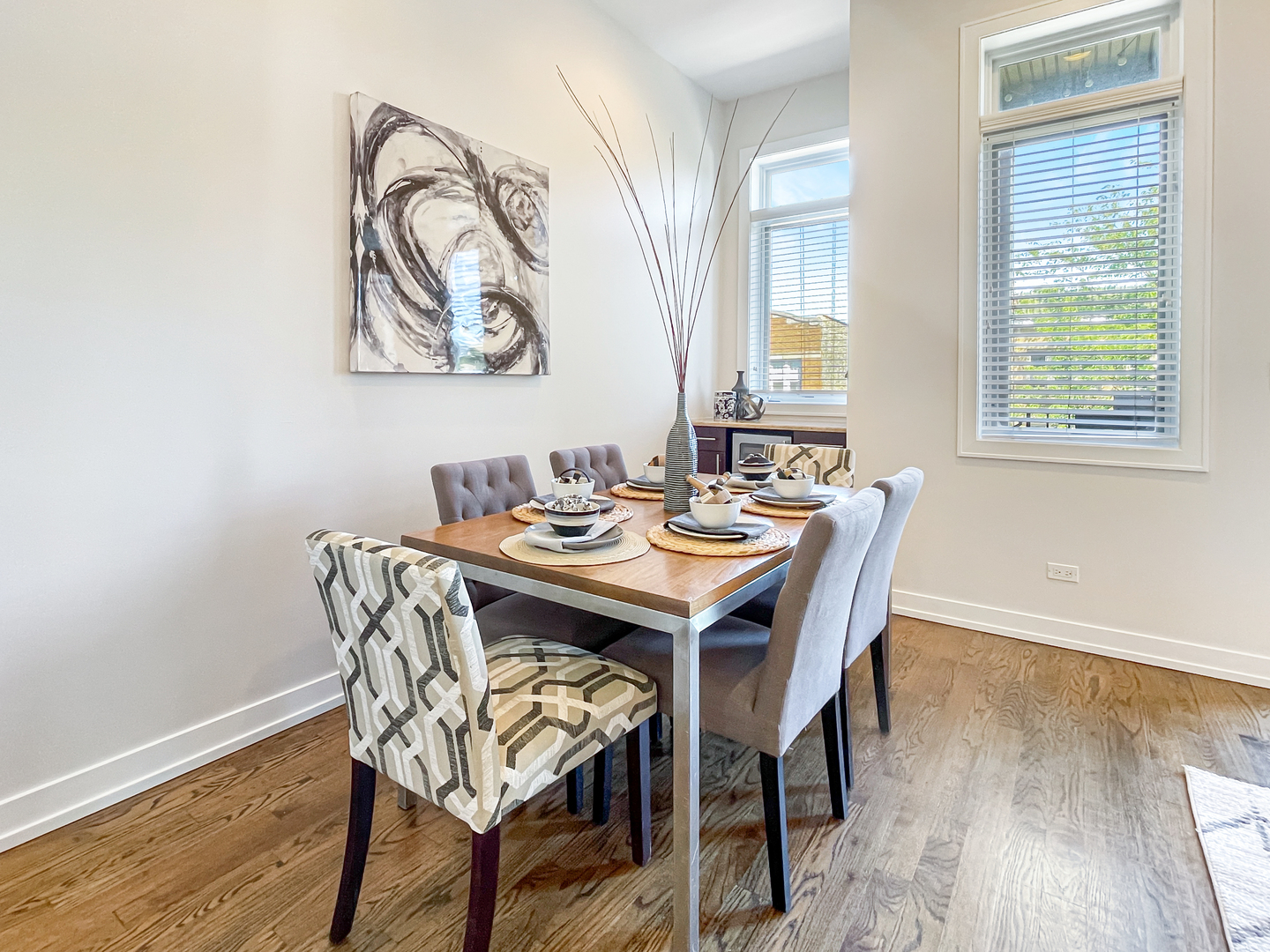 2207 West Roscoe Street, Unit 3E Chicago, IL 60618 - Photo 5 of 25 a view of a dining room with furniture window and wooden floor