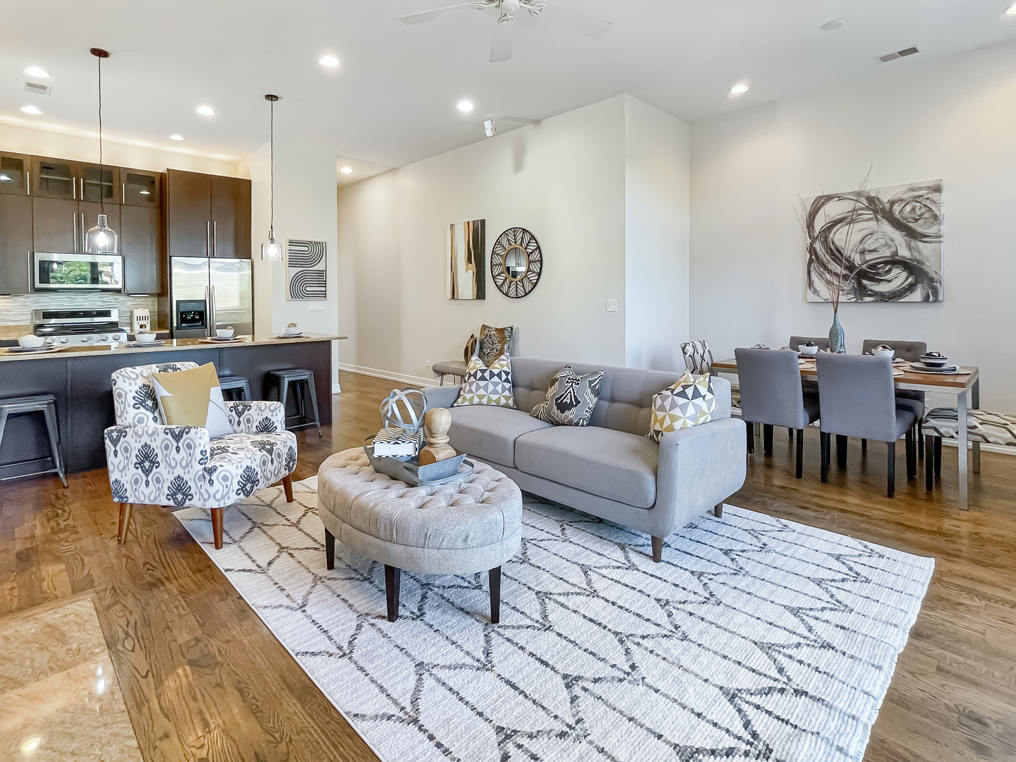 2207 West Roscoe Street, Unit 3E Chicago, IL 60618 - Photo 9 of 25 a living room with furniture and a wooden floor