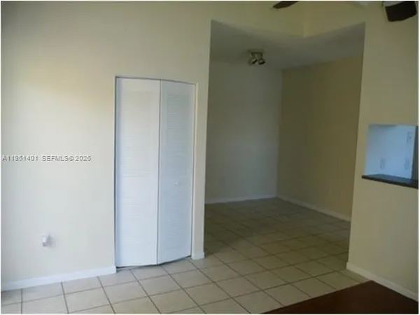 a view of a living room with bathroom