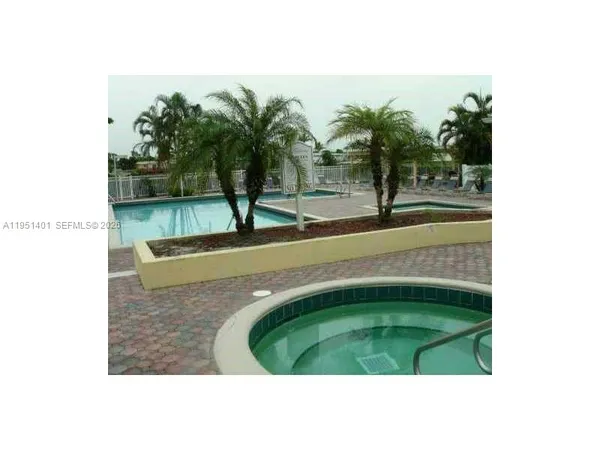 a view of a backyard with sitting area