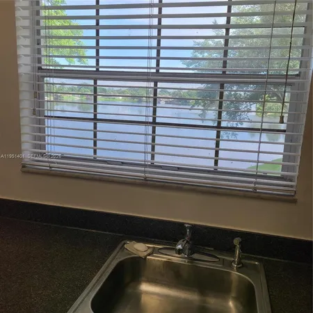 a close view of sink and a window