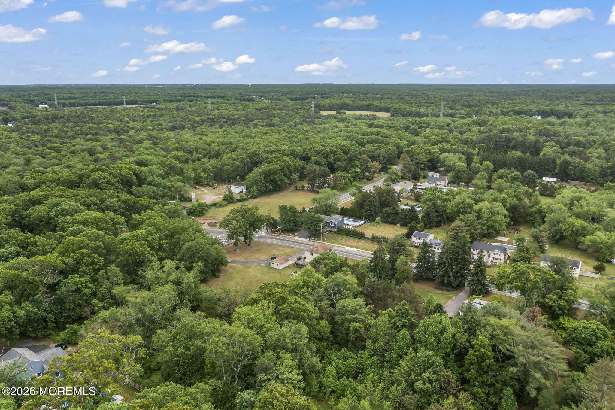 438 Bennetts Mills Road Jackson, NJ 08527 - Photo 40 of 42 a view of a green field with an ocean view