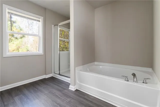 a white bath tub sitting next to a window