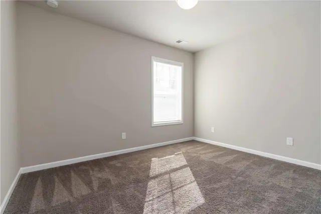 a view of an empty room and window