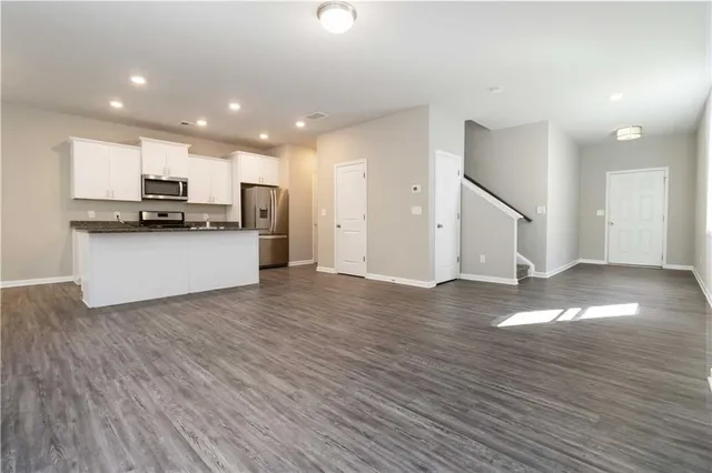 a view of a kitchen with a sink and a stove top oven