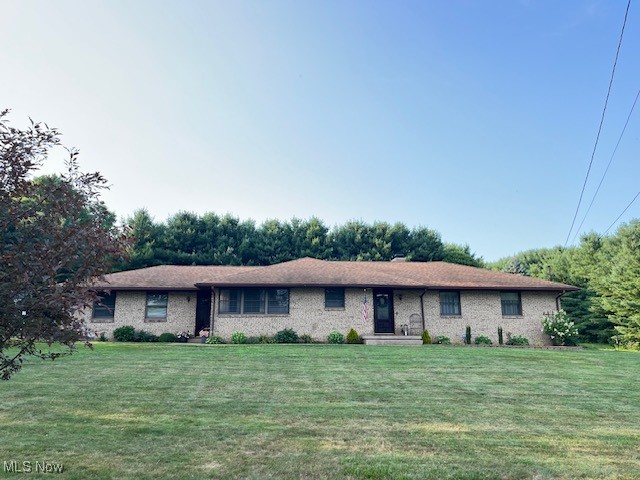 5795 Merwin Chase Road Brookfield, OH 44403 - Photo 1 of 39 Ranch-style house featuring brick siding and a front lawn