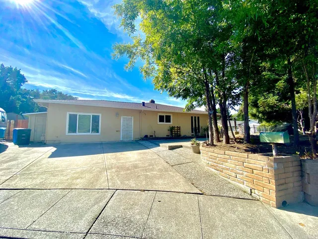 a view of a house with snow on the road