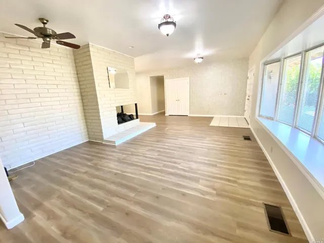 a view of a livingroom with wooden floor