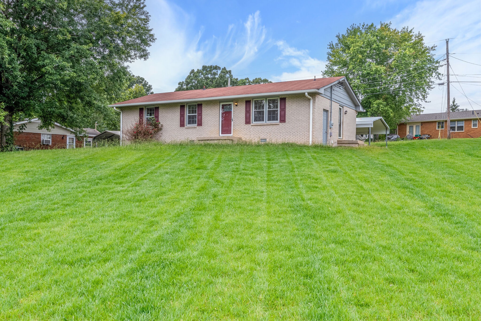 108 Chestnut Drive Dickson, TN 37055 - Photo 2 of 25 a front view of a house with a garden