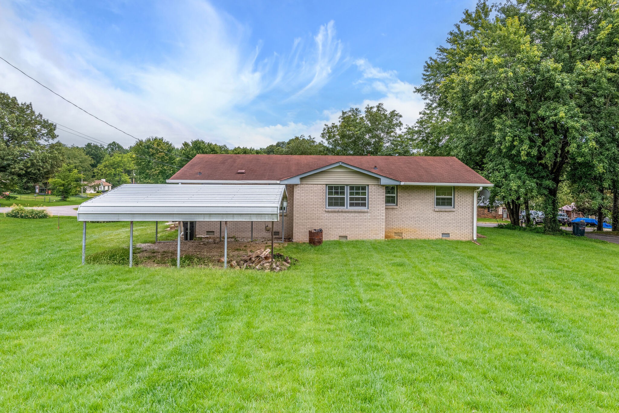 108 Chestnut Drive Dickson, TN 37055 - Photo 24 of 25 a aerial view of a house with a yard table and chairs