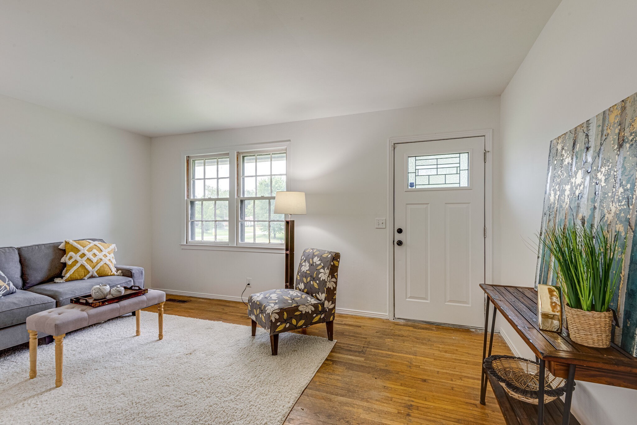 108 Chestnut Drive Dickson, TN 37055 - Photo 3 of 25 a living room with furniture and a potted plant next to a window